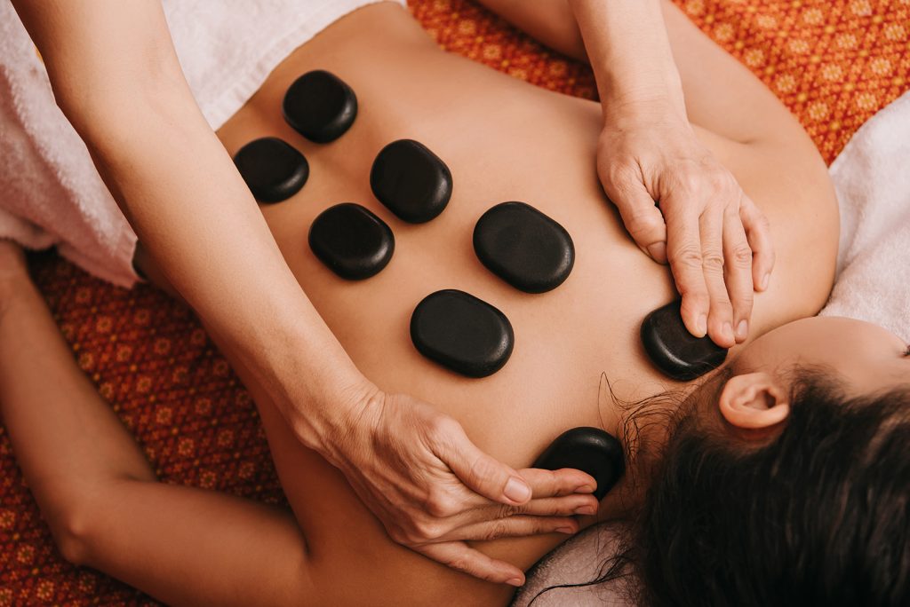 https://fit4lifephysio.com/wp-content/uploads/2021/02/hot-stone-massage-1024x684.jpg